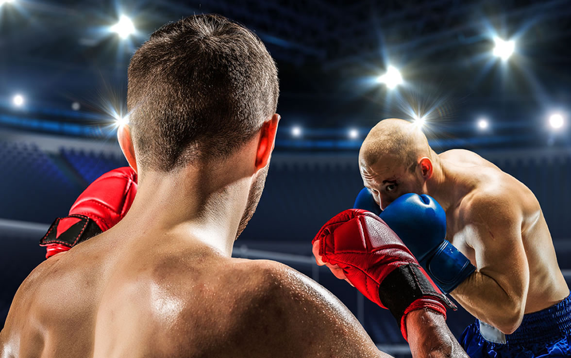 Two boxers facing each other in the ring